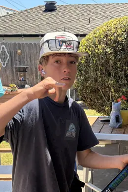 Cody, High Tide Window Cleaning crew member, with a water-fed pole