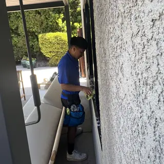 Before photo texted after a job: crew detailing a patio window frame